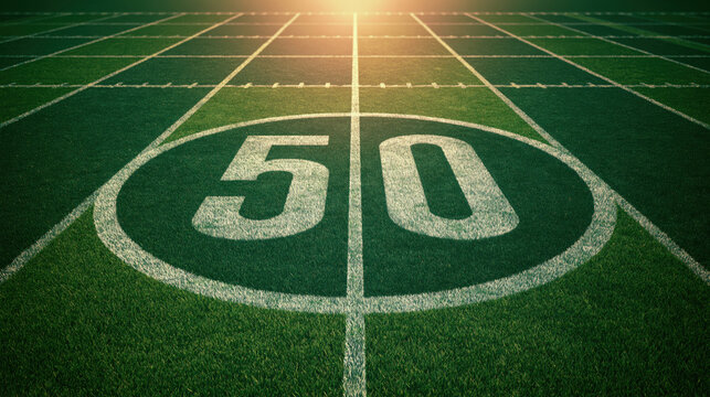 Football field midfield line yard line green turf fifty yard sport stadium game field white marking grass texture symmetrical view