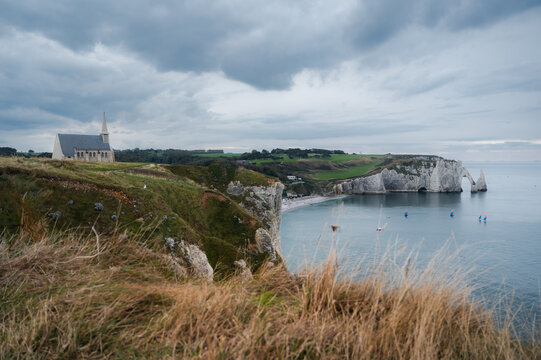 Panoramic view of Chapelle Notre-Dame-de-la-Garde and white cliffs. Scenic landscape, travel destination, sightseeing. Copy space banner