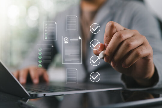 Businessman reviewing and approving digital documents on tablet, verifying contracts, certificates, compliance requirements, legal records, and business decisions through secure workflow processes.