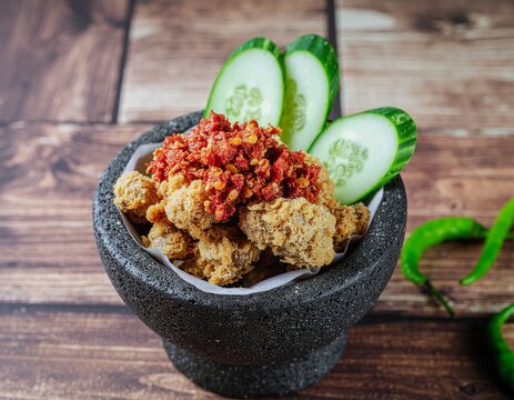 Spicy Ayam Geprek Served in Rustic Stone Mortar 