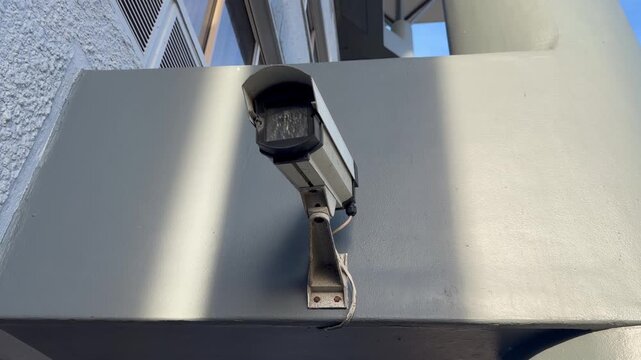 CCTV and Surveillance Camera outside a modern office building.