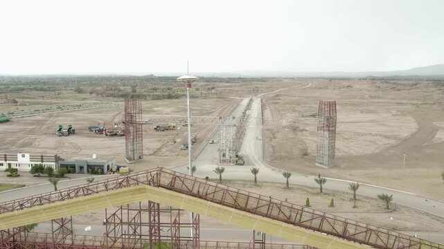 Broad roads and gateway structures under construction at Capital Smart City, Pakistan