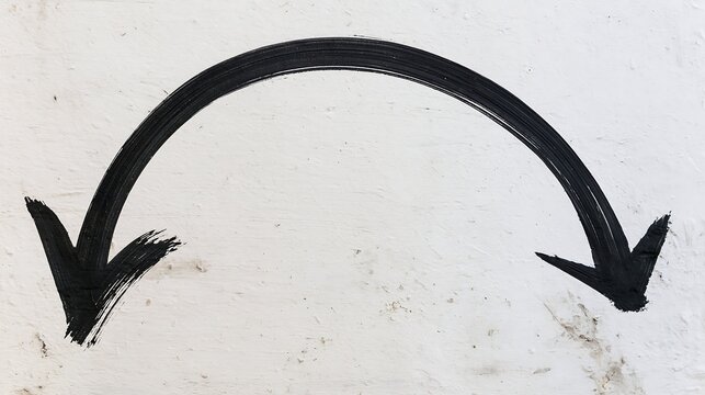 Wide arched black marker arrow with a smooth downward curve painted on a rough white wall. Ideal for business strategy and direction concepts.