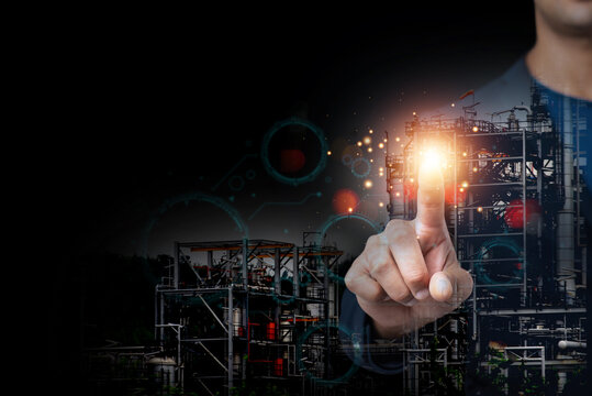 Businessman pointing at futuristic oil refinery with digital UI interface. Industrial technology concept. Human-created, not AI.