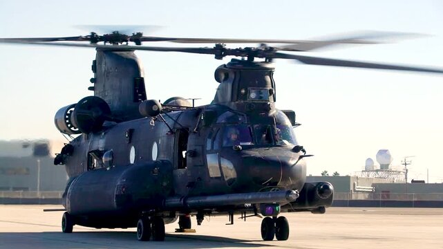 Military Helicopter Prepares for Takeoff on Airfield Runway During Daylight Aviation Training Operations at Base.