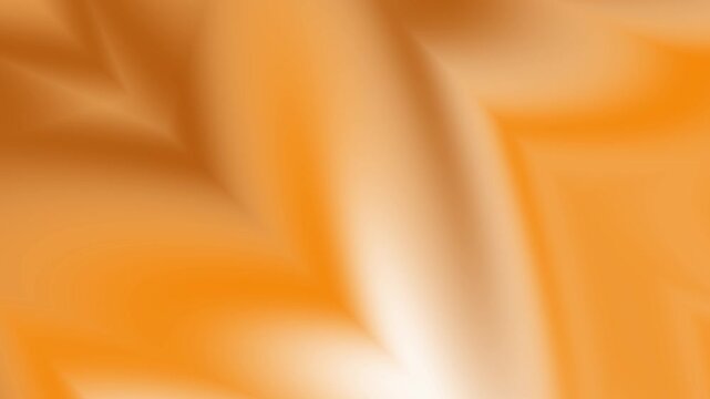Smooth golden orange silk fabric background with soft flowing waves and elegant folds creating a luxurious and gentle aesthetic for high quality design projects and creative backgrounds