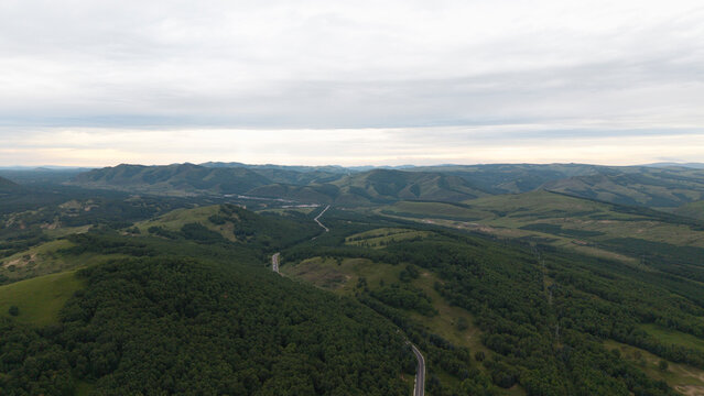 Aerial panoramic view of Huanggangliang National Forest Park in Chifeng, Inner Mongolia. Vast forest mountain natural landscape, dense woods, mountainous terrain and magnificent northern forest scener