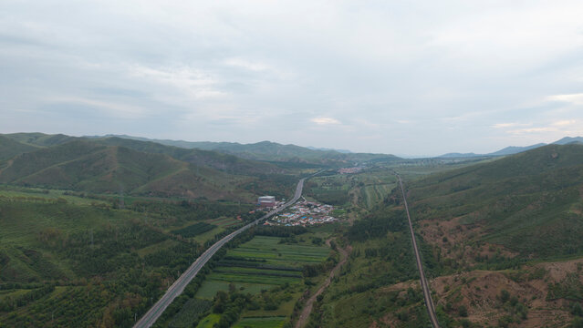 Aerial panoramic view of Huanggangliang National Forest Park in Chifeng, Inner Mongolia. Vast forest mountain natural landscape, dense woods, mountainous terrain and magnificent northern forest scener