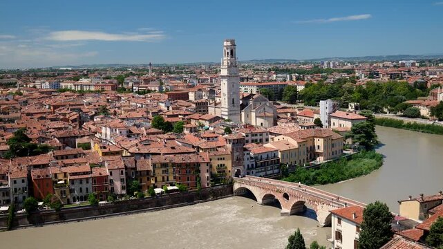 Verona skyline with Adige River, stone bridge, cathedral tower and terracotta rooftops, establishing overview backdrop