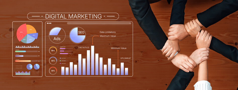 Team Collaboration in Digital Marketing Strategy with Data Visualization Tools and Charts on a Wooden Table Displaying SEO and Advertising Metrics. Bitwise.