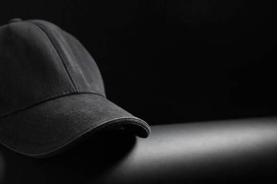 Stylish blank cap on dark background