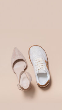 Footwear display featuring a high heel and a sneaker on a neutral background