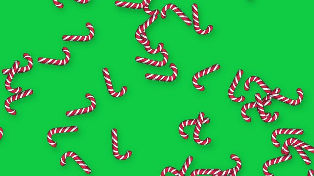 Animated Candy Canes Falling Slowly Over a Solid Green Background