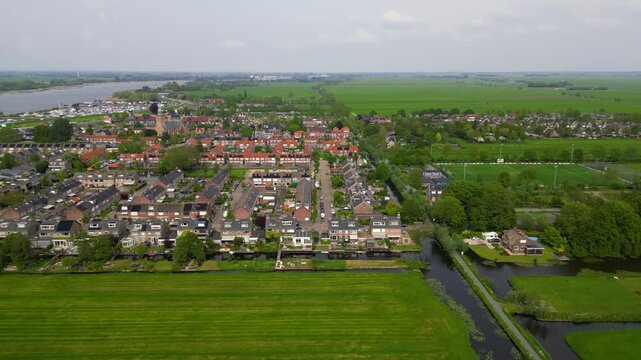 Aerial view of a dutch town Streefkerk surrounded by green fields