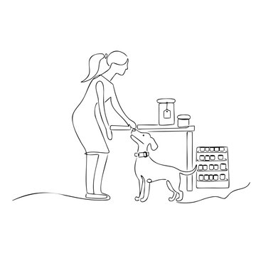 Woman feeding happy dog standing near pet supply station with food containers and shelves for veterinary care or nutrition content.