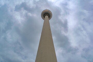 Low angle view of the Berlin television tower against a cloudy sky © Pavel Jiranek