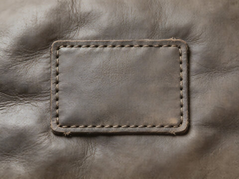 Closeup of leather patch with stitching