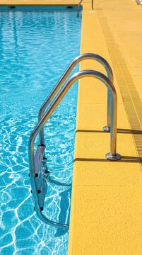 Minimal Swimming Pool Ladder with Bold Yellow Copy Space