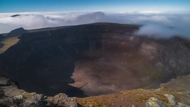 Clouds rolling over the volcanic crater on terceira island azores
