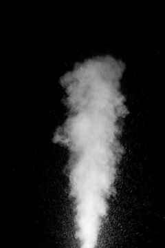Cloud of white dust particles floating in dark air on black background. Swirling, writhing smoke to overlay on your photos. evoking mystery, motion, and atmosphere