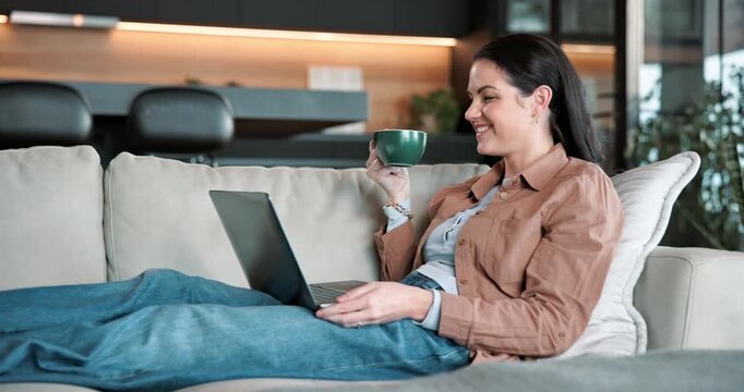 Laptop, movie and woman with coffee in house, relax and watching series with subscription in lounge. Streaming, online and happy person with hot beverage, chilling and entertainment with tech in home