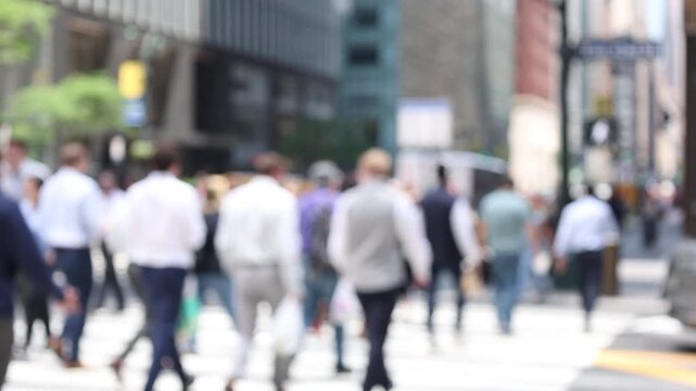 Slow motion scene group of multiple unrecognised people walk along in the outside business building tower in financial district in weekend for people lifestyle and activity concept