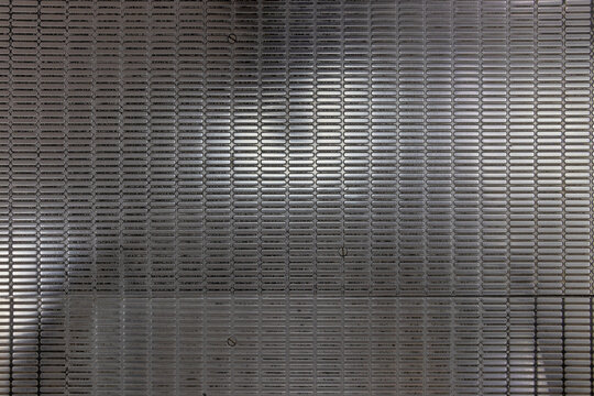 nonslip textured pattern of stainless steel, metallic floor plate of the escalator