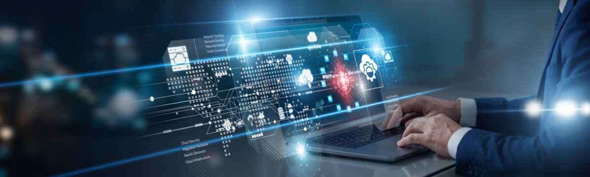 Cloud architect working on laptop managing Platform as a Service deployments. They provision scalable computing resources, ensuring high availability and seamless infrastructure for developers.
