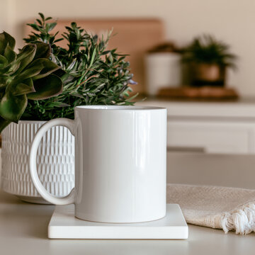 White ceramic mug, succulent plant, modern kitchen, natural light, minimal style, home decor, cozy atmosphere