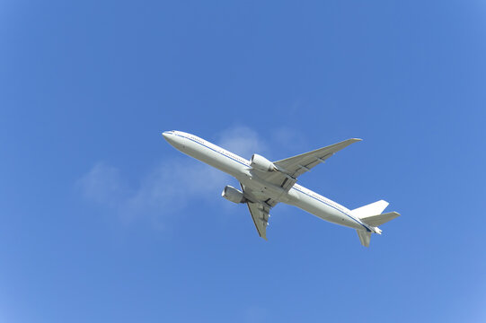 Commercial Passenger Airliner Flying in Clear Blue Sky