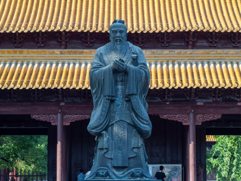 Confucius Statue in Traditional Chinese Temple Courtyard