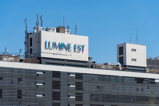 SHINJUKU-KU, TOKYO, JAPAN - AUGUST 25, 2026: Rooftop logo signboard and upper part of Lumine Est shopping building at Shinjuku Station East Exit in Shinjuku-ku, Tokyo.