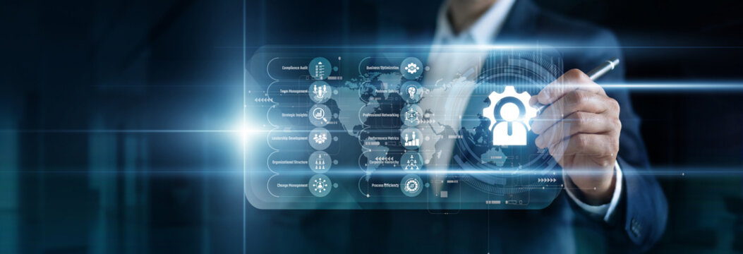 Management Consulting point: Advisor mapping corporate strategy on a virtual screen. Analyzing performance metrics, restructuring organizational hierarchies, and identifying growth for clients.