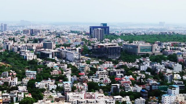 Wide view of City Police Commissionerate with KBR park, skyline, Residential buildings and Park Hyatt Hotel at hyderabad, telangana, india. day time, slight arc shot, drone shot, 4k.