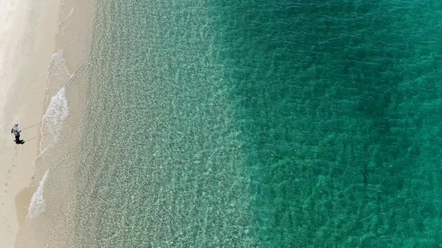 Aerial top down of fly fisherman on beach in La Ventana, Baja California Sur.