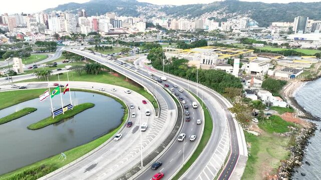 Florian&oacute;polis, Pedro Ivo Campos and Colombo Salles bridges. Aerial drone view of urban traffic and cityscape. Establishing shot.