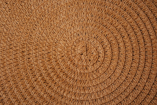 Woven straw texture with concentric circles pattern