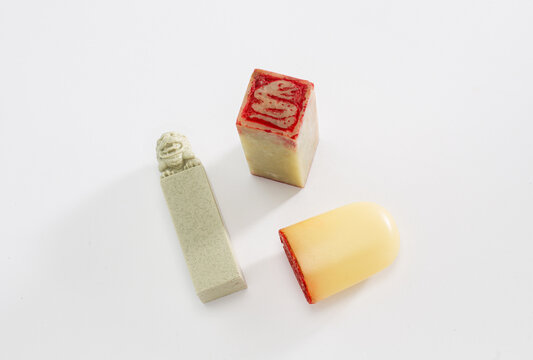 Traditional Chinese carved stone seals and stamps with red ink isolated on white background