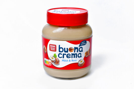Germany, May 27th 2026: Jar of REWE Beste Wahl Buona Crema milk and hazelnut spread on white background. Sweet chocolate nut cream for breakfast and indulgent snacking