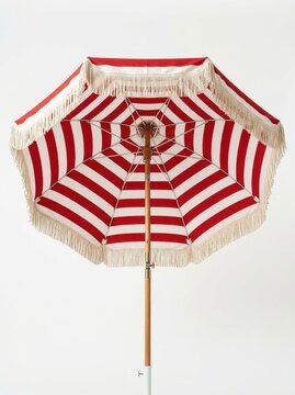 Vintage Red and White Striped Beach Umbrella with Fringe Isolated on White Background for Summer Vacation