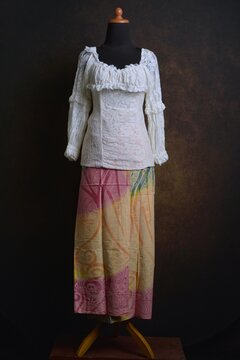 Indonesian Kebaya with Lace Sheer Fabric with Batik Skirt on a Display Mannequin
