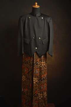 Traditional Javanese Suit with Beskap and Batik Sarong on a Mannequin Display 