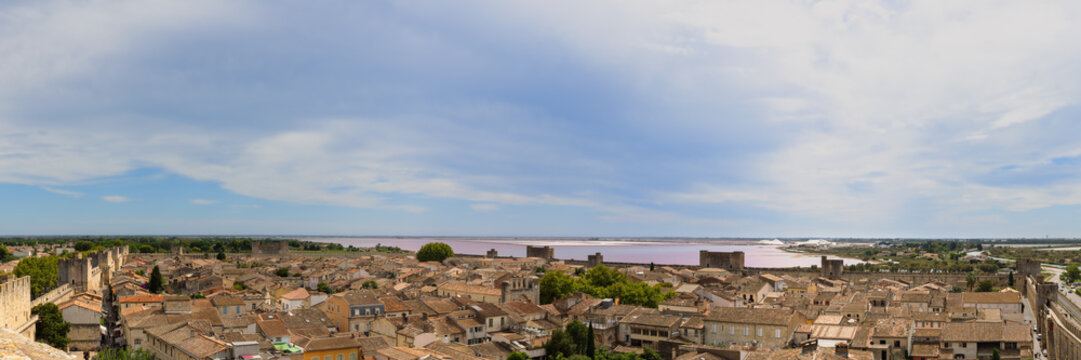 Panoramic view from the medieval city wall over the old town of Aigues-Mortes and the salines in the south of France.