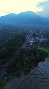 the beauty of the foggy morning panorama with sunrise and rice fields in Bengkulu, indonesia, asia