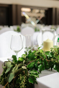 Elegant wedding table setting with fresh greenery