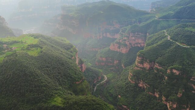 Aerial panorama of magnificent Taihang Mountains grand canyon with steep layered rock cliffs, natural geological landforms in China