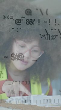 Animation of data processing over female engineer in hi vis vest with 3d building model
