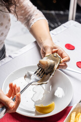 Eating Raw Oyster with a Fork © udeyismail