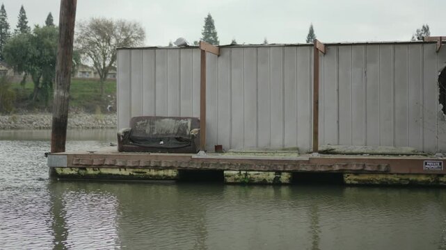 Abandoned Sofa Floating on Sacramento River Dock Structure