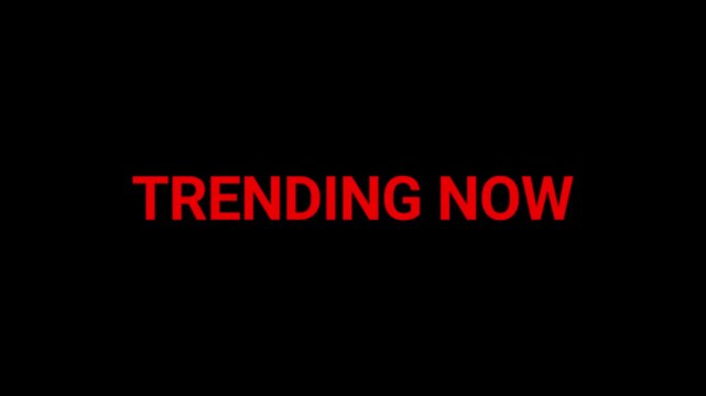 Trending now text in vibrant red letters stands out against a deep black background to highlight popular subjects or viral content.